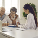 elderly couple discussing about estate planning with lawyer