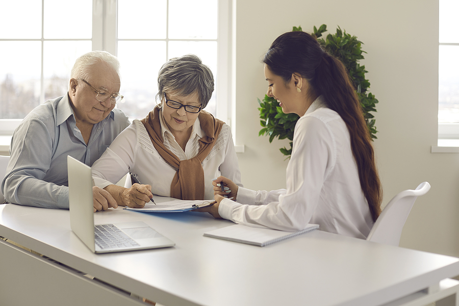 elderly couple discussing about estate planning with lawyer